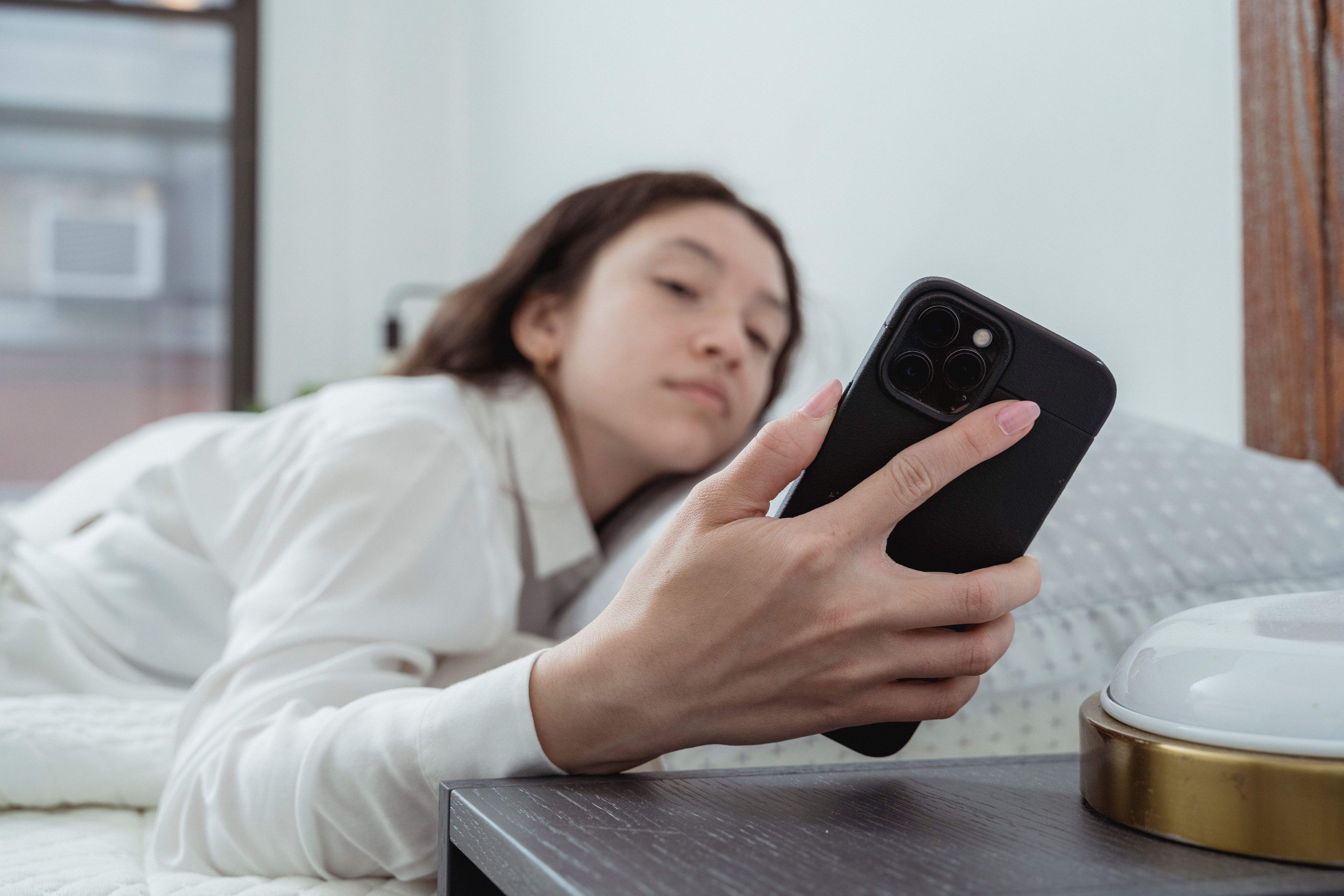 Early morning light falling across a kitchen counter, a phone face-down beside a mug